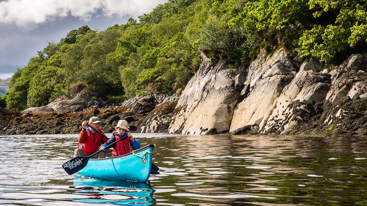 Father and daughter canoeing on Loch Sunart